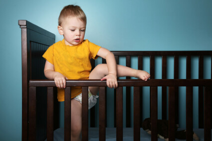 Toddler Climbing Out of the Crib 