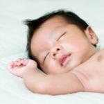 Newborn Baby Boy Sleeping On Back Thumbnail