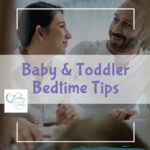 Mom and dad placing their baby in a crib as part of a bedtime routine
