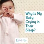 Baby rubbing eyes and putting hand to mouth while waking at night, illustrating baby crying in sleep