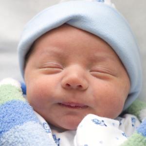 Newborn Wrapped in Blue