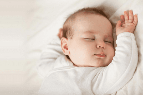 Sleeping Baby with arm near face