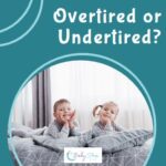 twin toddlers awake in bed looking alert and happy, possible overtired or undertired at bedtime