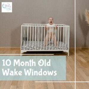 10 month old baby standing in crib awake during wake window before bedtime